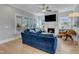 Cozy living room featuring a fireplace, built-in shelving, and a comfortable blue sofa at 1421 Sweetclover Dr, Wake Forest, NC 27587