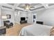Spacious main bedroom with hardwood floors, complemented by ample closet space for optimal organization at 1421 Sweetclover Dr, Wake Forest, NC 27587