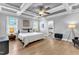 Bright main bedroom featuring hardwood floors, and stylish decor for a refined, relaxing retreat at 1421 Sweetclover Dr, Wake Forest, NC 27587