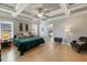 Comfortable main bedroom featuring a beautiful ceiling, light floors, and plenty of natural light at 1421 Sweetclover Dr, Wake Forest, NC 27587