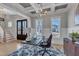 Bright office featuring stylish decor, a modern light fixture and a dark wooden desk at 1421 Sweetclover Dr, Wake Forest, NC 27587