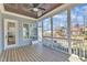 Cozy screened porch with wood floors, screens, and natural light at 1421 Sweetclover Dr, Wake Forest, NC 27587