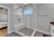 Modern shower with a glass enclosure, white subway tile, a built-in bench and niche, and neutral tile flooring at 1421 Sweetclover Dr, Wake Forest, NC 27587