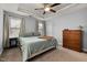 Bedroom featuring neutral walls, a bed, a dresser, and two windows at 176 E Ravano Dr, Clayton, NC 27527