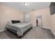 Bedroom with a queen-sized bed, neutral walls, and a full length mirror at 176 E Ravano Dr, Clayton, NC 27527