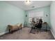 Bedroom area with sage green walls, a comfortable bench, and a cozy workspace at 176 E Ravano Dr, Clayton, NC 27527