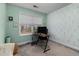 Bedroom area with sage green walls, a large window with a view of the outdoors at 176 E Ravano Dr, Clayton, NC 27527