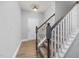 Inviting foyer features hardwood floors, staircase with carpet, and a coat closet at 176 E Ravano Dr, Clayton, NC 27527