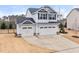 Charming two-story home featuring a two car garage, landscaped yard, and neutral colored siding at 176 E Ravano Dr, Clayton, NC 27527
