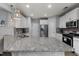 Bright kitchen featuring granite countertops, stainless steel appliances, and modern lighting fixtures at 176 E Ravano Dr, Clayton, NC 27527