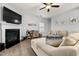 Cozy living room boasts a fireplace, hardwood flooring, and comfortable seating at 176 E Ravano Dr, Clayton, NC 27527