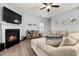 Cozy living room boasts a fireplace, hardwood flooring, and comfortable seating at 176 E Ravano Dr, Clayton, NC 27527
