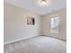 Neutral bedroom with large window for natural light, carpeted floors, and minimalist decor at 186 Madden Rose Loop, Garner, NC 27529