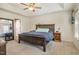 Bedroom with a wooden bed frame and a tray ceiling at 205 Sarazen Dr, Clayton, NC 27527