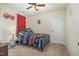 Small bedroom with a car themed bed, firetruck decor, a ceiling fan and a door to the hallway at 205 Sarazen Dr, Clayton, NC 27527