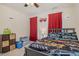 Cozy bedroom features vibrant car-themed bedding, red curtains, and a ceiling fan at 205 Sarazen Dr, Clayton, NC 27527