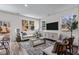 Bright living room with large windows, stylish furniture, and a modern media console at 2111 Trailside Dr Dr, Durham, NC 27704