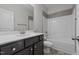 Bathroom with a vanity, neutral-tiled shower and tub, and modern fixtures at 229 S Prince Henry Way Way, Cameron, NC 28326