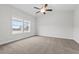 Empty carpeted bedroom with a window bringing in natural light and a ceiling fan at 229 S Prince Henry Way Way, Cameron, NC 28326
