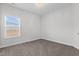 Empty carpeted bedroom with a window bringing in natural light and electrical outlets at 229 S Prince Henry Way Way, Cameron, NC 28326