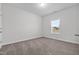 Simple, carpeted bedroom with a window bringing in natural light and electrical outlets at 229 S Prince Henry Way Way, Cameron, NC 28326