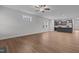 Open-concept living space with wood-look floors flowing seamlessly into the kitchen and dining areas at 229 S Prince Henry Way Way, Cameron, NC 28326