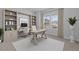 Bright home office with built-in shelving, a large desk, and ample natural light from the window at 229 S Prince Henry Way Way, Cameron, NC 28326