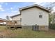 Spacious backyard with a wooden deck and an outdoor air conditioning unit at 2305 Fitzgerald Ave, Durham, NC 27707