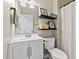 Clean bathroom with modern fixtures, shelving, and a shower curtain for a refreshing experience at 2305 Fitzgerald Ave, Durham, NC 27707