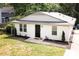 Charming single-story home featuring a newly painted exterior, manicured landscaping, and a welcoming entrance at 2305 Fitzgerald Ave, Durham, NC 27707