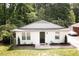 Charming single-story home featuring a newly painted exterior, manicured landscaping, and a welcoming entrance at 2305 Fitzgerald Ave, Durham, NC 27707