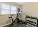 Home gym featuring stationary bike, weights and natural light from window at 2305 Fitzgerald Ave, Durham, NC 27707