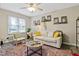 Cozy living room featuring neutral tones, a ceiling fan, and comfortable seating, perfect for relaxing and entertaining at 2305 Fitzgerald Ave, Durham, NC 27707