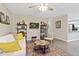 Inviting living room featuring neutral tones, a ceiling fan, and comfortable seating, perfect for relaxing and entertaining at 2305 Fitzgerald Ave, Durham, NC 27707