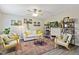 Spacious living room with modern decor, a ceiling fan, and natural light, creating a welcoming and stylish atmosphere at 2305 Fitzgerald Ave, Durham, NC 27707