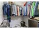 Organized walk-in closet with ample hanging space and storage solutions for clothes and accessories at 2305 Fitzgerald Ave, Durham, NC 27707