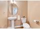 Cozy half bathroom with a pedestal sink, modern fixtures, and neutral wall color at 240 Forest Meadow Ln, Franklinton, NC 27525