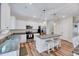 Well-equipped kitchen with granite countertops, stainless steel appliances, and a central island with seating at 240 Forest Meadow Ln, Franklinton, NC 27525