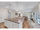 Bright and open floor plan showcasing the kitchen island, dining area and living room at 240 Forest Meadow Ln, Franklinton, NC 27525