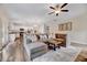 Open-concept living room with hardwood floors, modern furnishings, and access to the kitchen at 240 Forest Meadow Ln, Franklinton, NC 27525