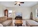 Cozy living room featuring hardwood floors, comfortable seating, and a decorative area rug at 240 Forest Meadow Ln, Franklinton, NC 27525