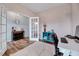 Well-lit home office with hardwood floors, stylish furnishings, and a view into the hallway at 240 Forest Meadow Ln, Franklinton, NC 27525