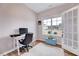 Bright office space with a large window, neutral walls, and a comfortable workspace at 240 Forest Meadow Ln, Franklinton, NC 27525