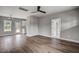 Open-concept living space with hardwood floors that connects to the kitchen at 2513 Rolesville Rd, Wake Forest, NC 27587