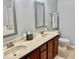 Bathroom featuring a double sink vanity, toilet, mirrors and towel rack at 2631 Cloud Mist Cir, Raleigh, NC 27614