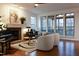 Inviting living room featuring a fireplace, piano, and comfortable seating area at 2688 Brighton Bluff Dr, Apex, NC 27539