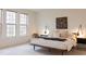 Serene bedroom boasts large windows and contemporary decor at 2688 Brighton Bluff Dr, Apex, NC 27539