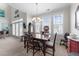 Bright dining room features large windows, a chandelier, and space for entertaining at 2810 Bedford Green Dr # 300, Raleigh, NC 27604