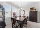Bright dining room with large windows and traditional wood furniture set at 2810 Bedford Green Dr # 300, Raleigh, NC 27604