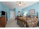 Spacious main bedroom with ceiling fan, dresser, and a comfortable bed at 2810 Bedford Green Dr # 300, Raleigh, NC 27604
